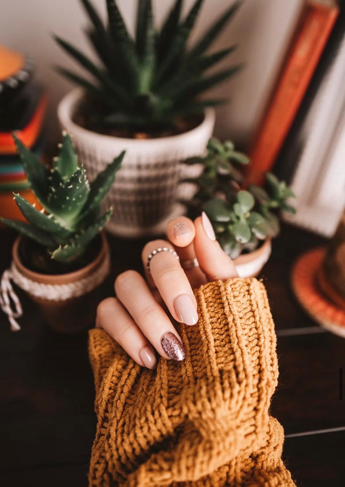 Soft nude manicure with a glitter accent nail